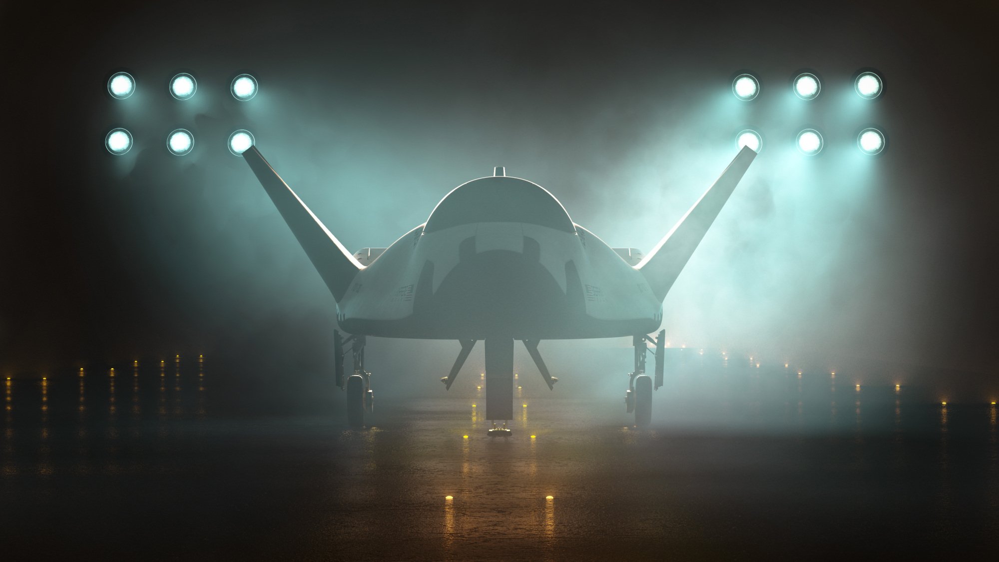Dream Chaser spaceplane sits on a runway in the dark