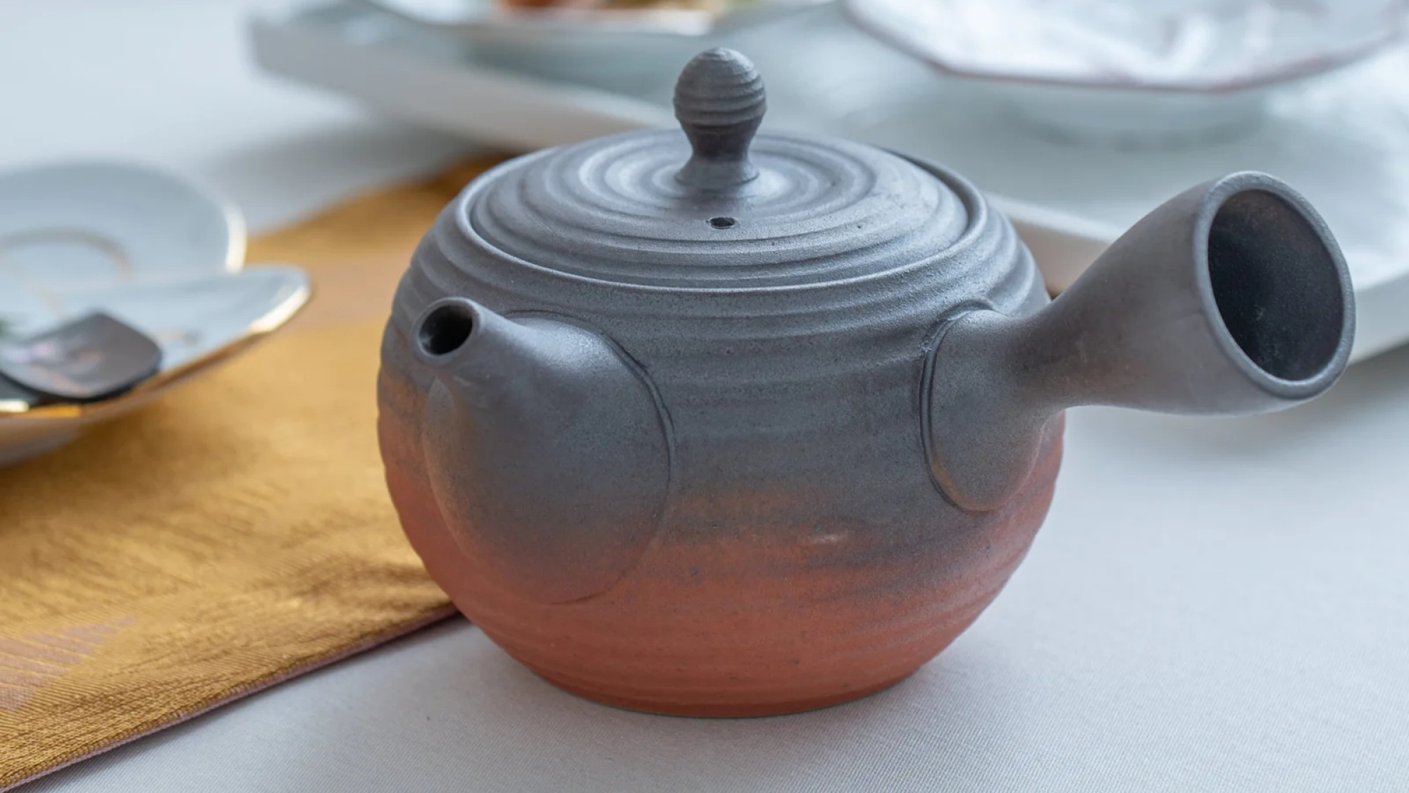 Musubi Kiln Isshin Brown and Red Tokoname Japanese Teapot.