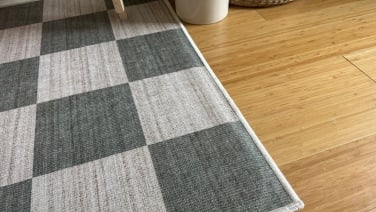 Close up of rug pad showing through the top of a Tumble rug