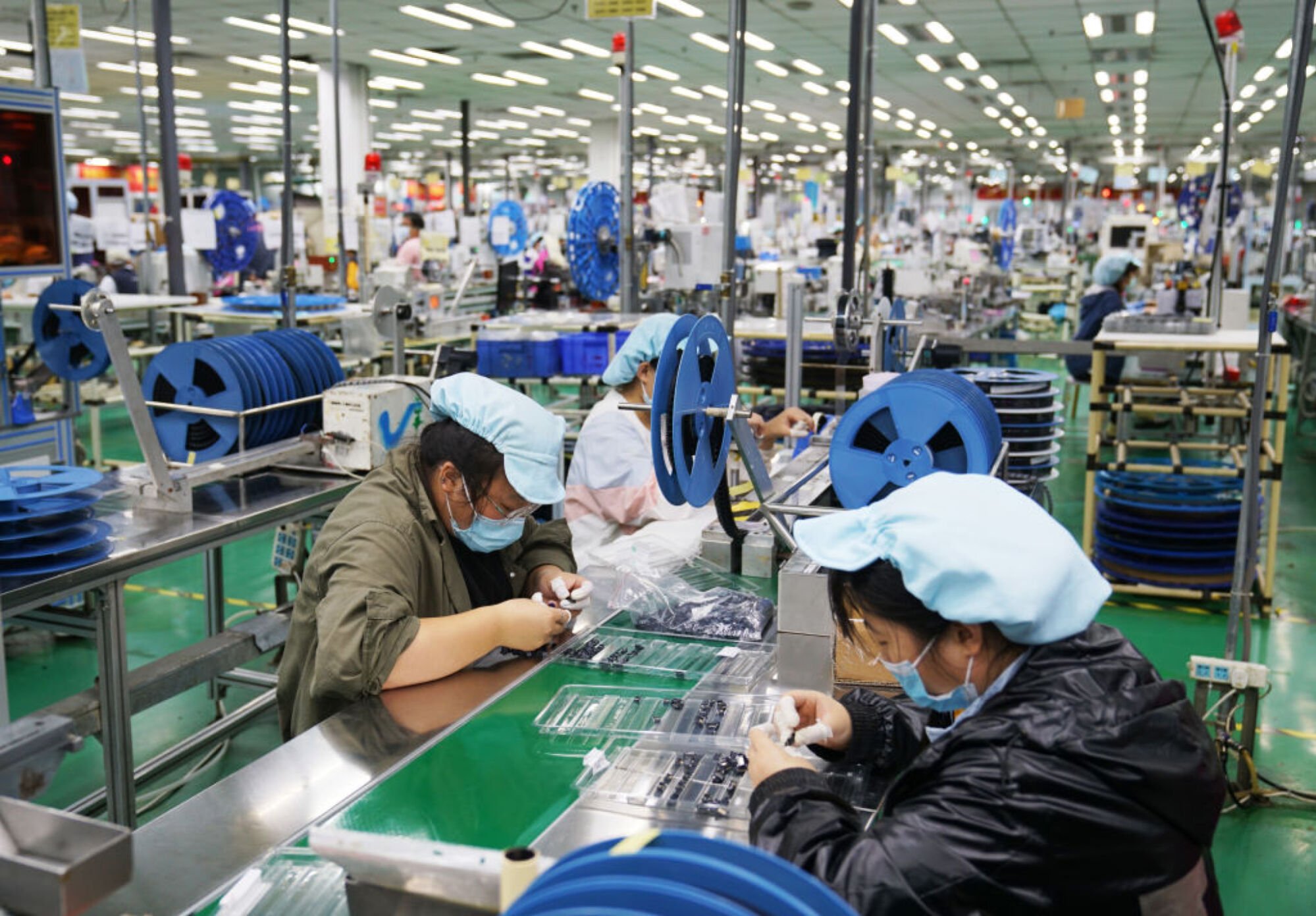 Employees work at a Foxconn factory in Zhengzhou City, China.