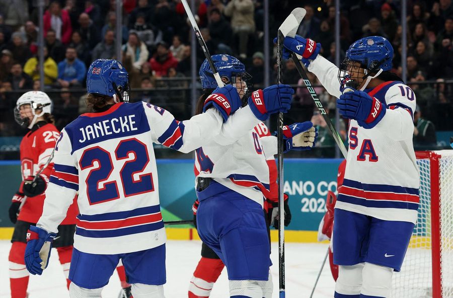 Joy Dunne of United States celebrates with Tessa Janecke and Laila Edwards after scoring their secon