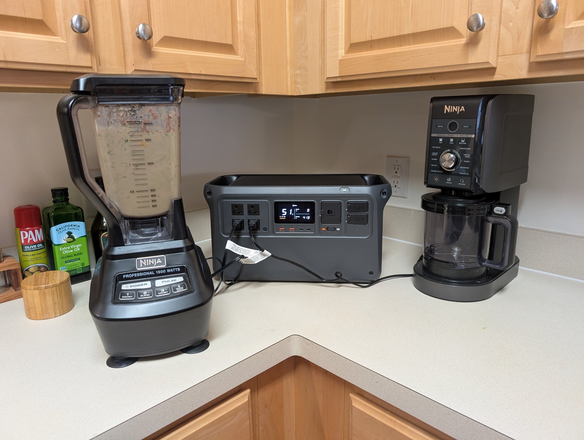 the dji power 1000 v2 portable power station sits on a kitchen counter powering a blender